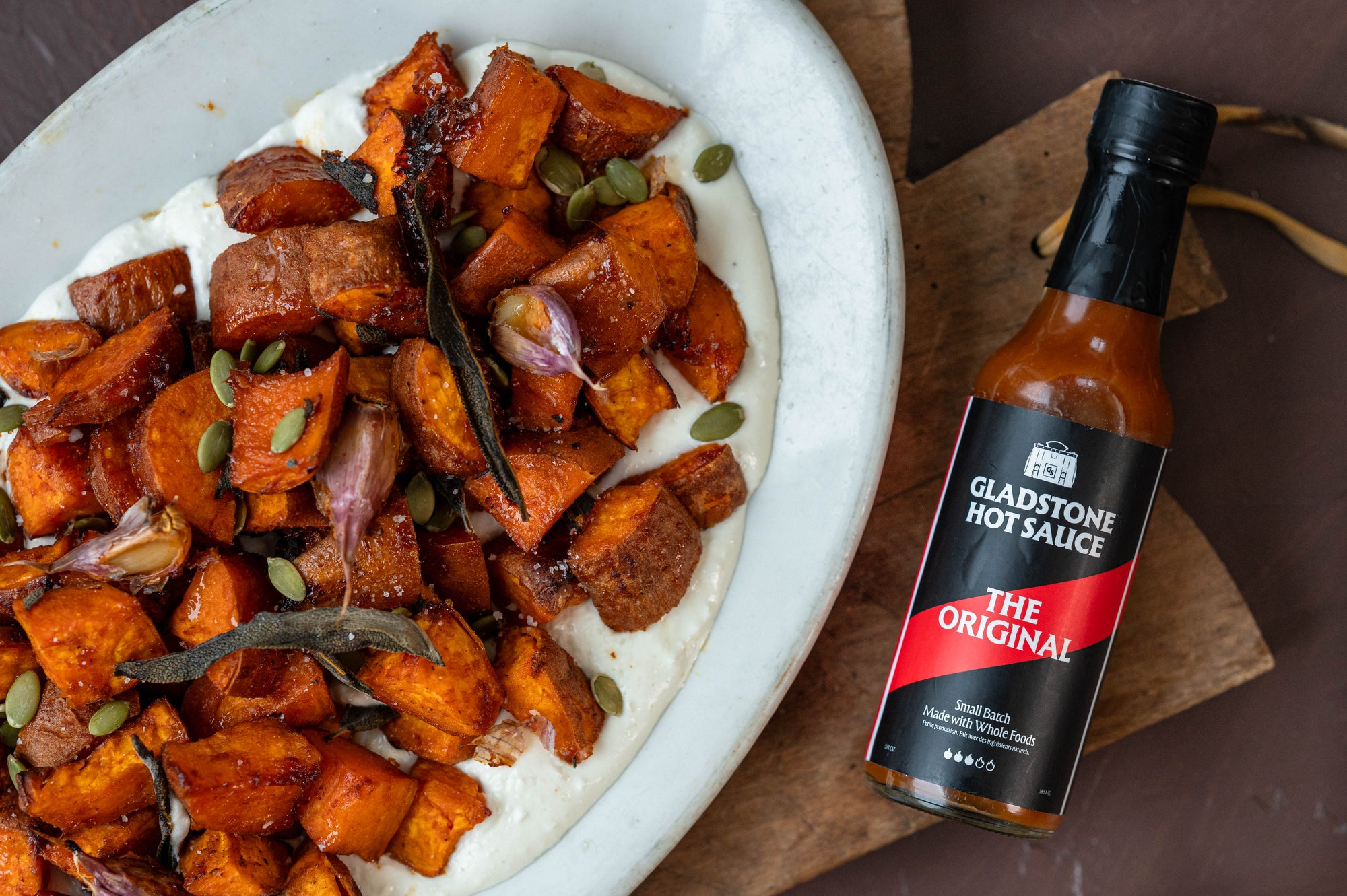 spicy roasted sweet potatoes and a whipped feta sauce
